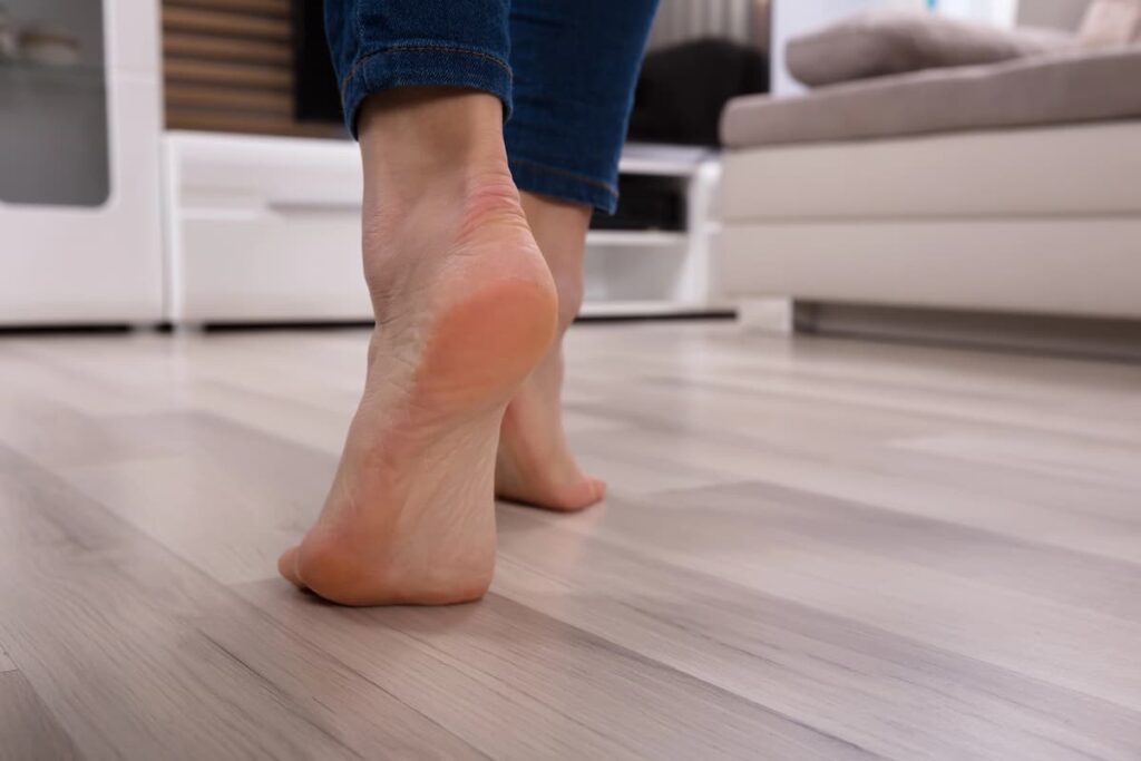 Close-up Of An Foot Walking On Heated Floor